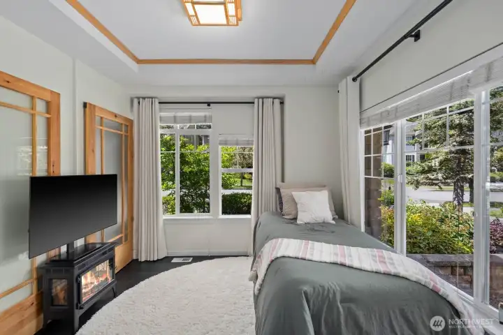 Main floor bedroom with closet and heated flooring