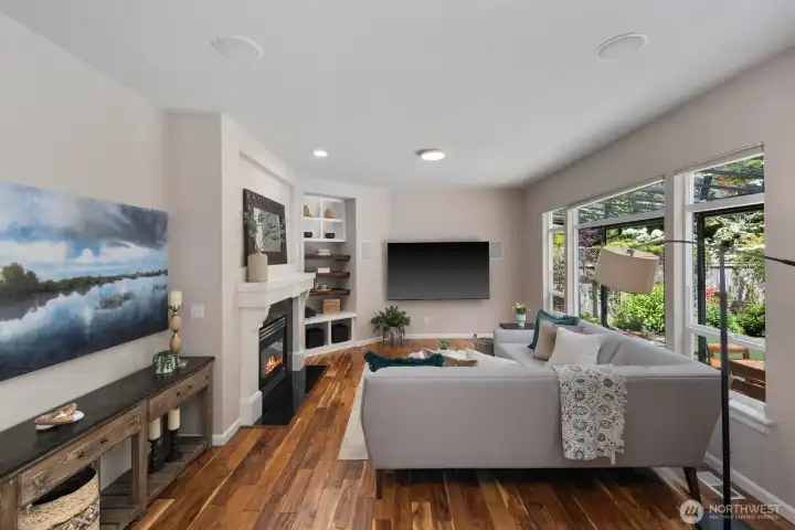 Family room with built-in shelving and gas fireplace