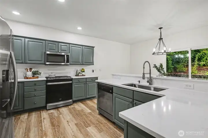 Gorgeous updated kitchen with all new quartz counters, refinished cabinets & new cabinet hardware