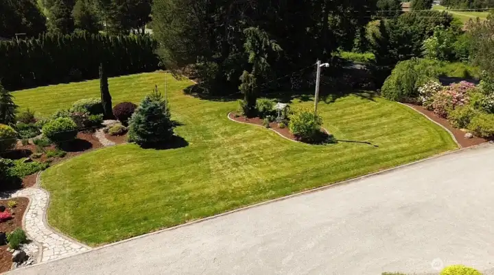 Mature landscaping creates natural privacy and a calm, established setting