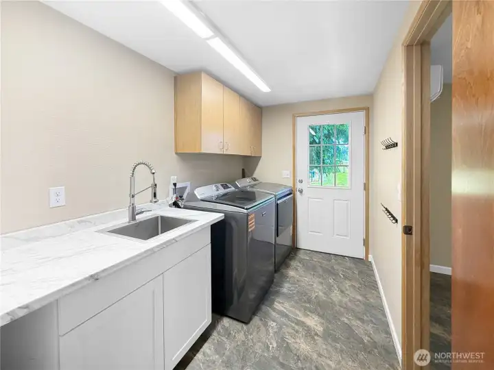 Laundry room / Mud room with entry- making it easy to work outside and not bring it inside.