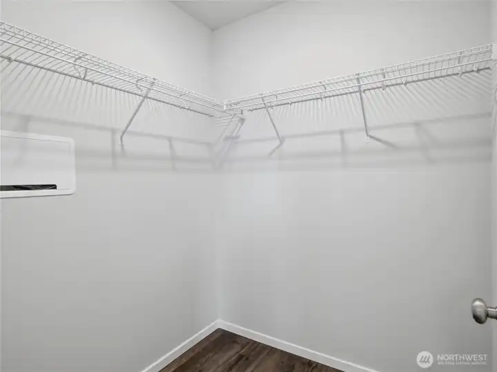 Primary walk-in closet. Primary walk-in closet.