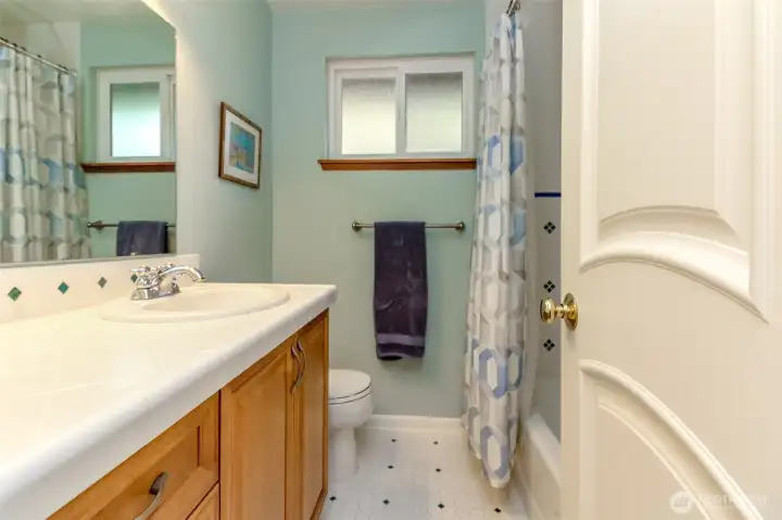 full bathroom fully tiled