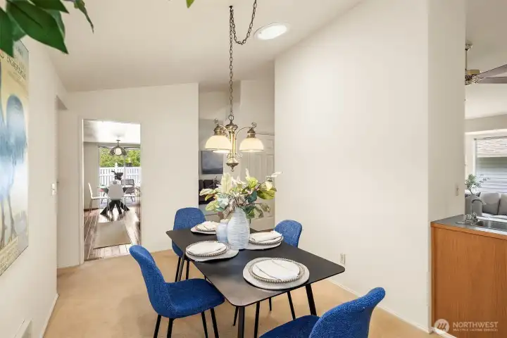 Another angle of dining room showing proximity to kitchen and wet bar. Another angle of dining room showing proximity to kitchen and wet bar.