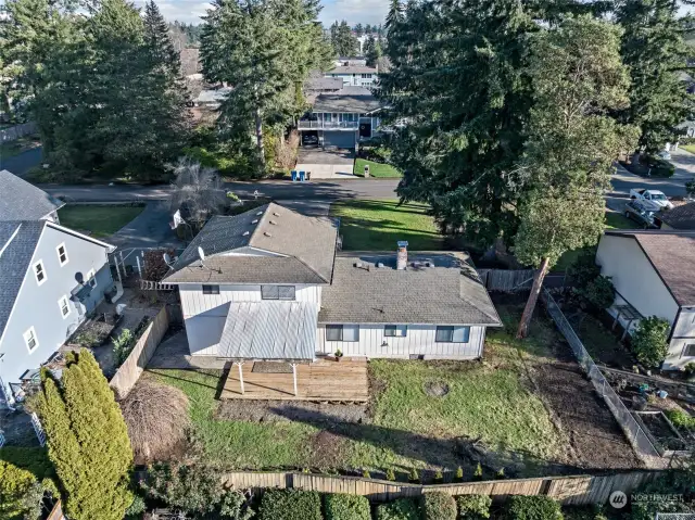 The fully fenced yard keeps the things you love safe. Covered deck allows a dry outdoor space all year long, NICE!!