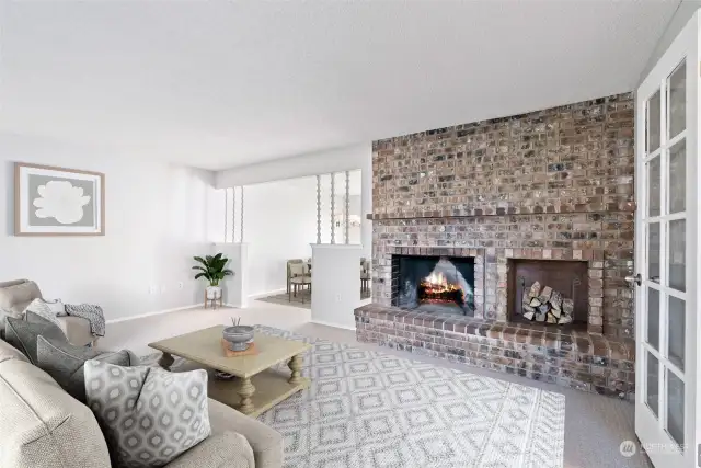 The living room flows nicely into the dining room on the left.