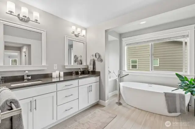 Primary Bathroom with Free Standing Soaking Tub, Dual Vanities.