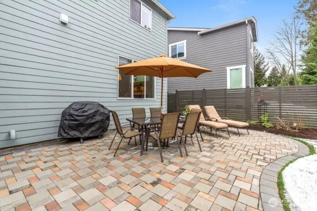 Newer Stone Patio with a Walkway that Wraps Around the Side of the Home