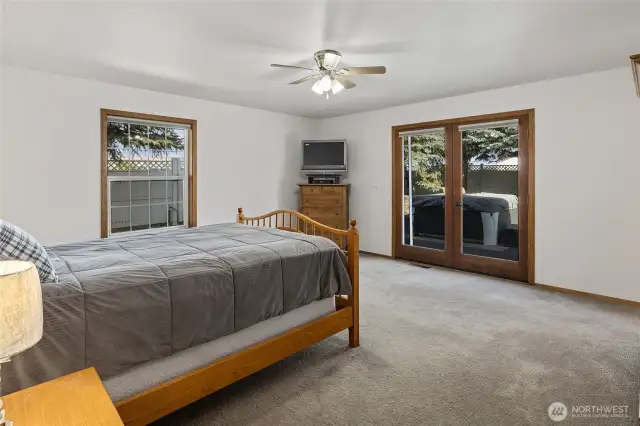 The primary bedroom is good size and has access to the back deck and hot tub!