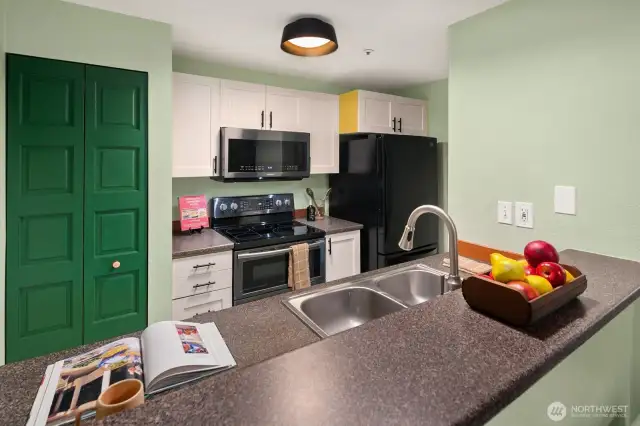 Open living/dining/kitchen w/ slider opening to patio & yard space