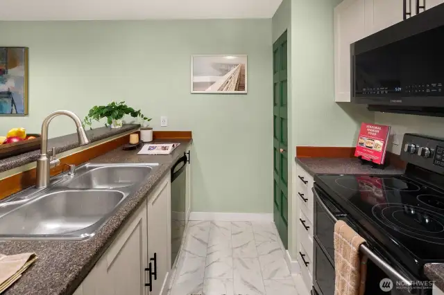 Open living/dining/kitchen w/ slider opening to patio & yard space