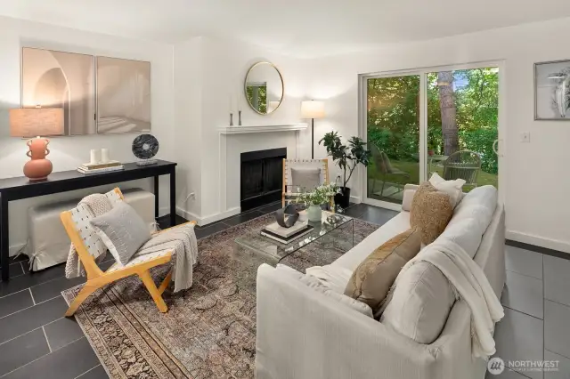 Open living/dining/kitchen w/ slider opening to patio & yard space
