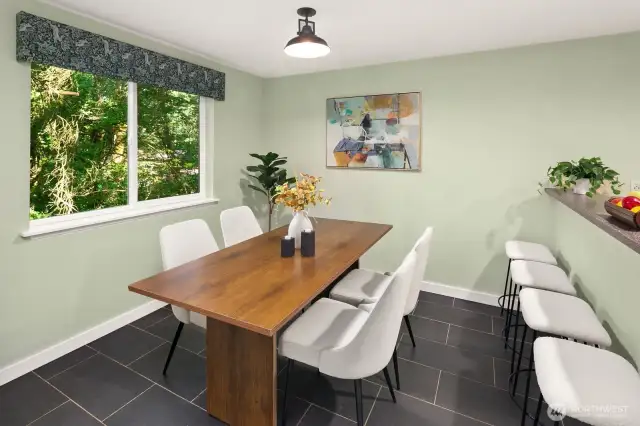 Open living/dining/kitchen w/ slider opening to patio & yard space