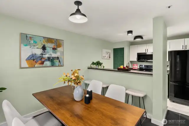 Open living/dining/kitchen w/ slider opening to patio & yard space