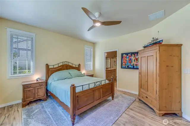 The wide plank flooring runs through the entire home. The home has air conditioning or open the windows and let the contemporary ceiling fan keep the room the perfect temperature.