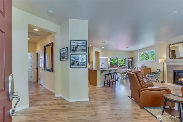 Enter on to newer wide plank flooring into the great room. The office and bedroom wing is to the left.