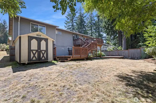 Backyard with multi-level deck and storage shed