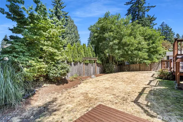 Backyard with multi-level deck and storage shed