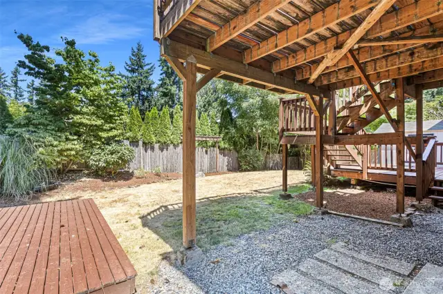 Backyard with multi-level deck and storage shed