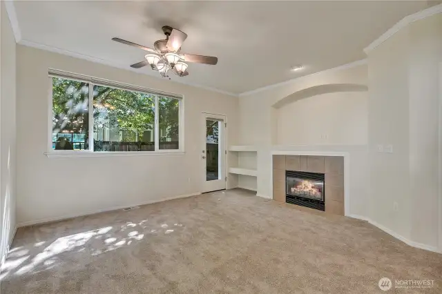 Nicely sized living room open to the kitchen with gas fireplace & media nook ~