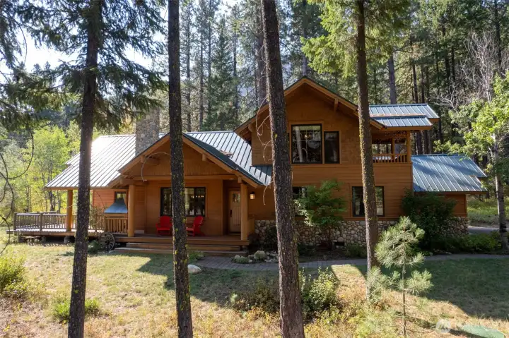 Side view with garage – Well-designed layout with attached garage and landscaped pathways.