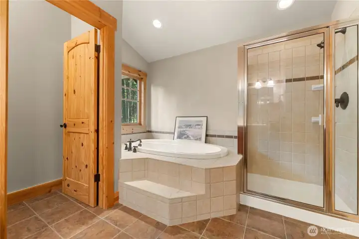 Ensuite bathroom with double vanity and soaking tub.