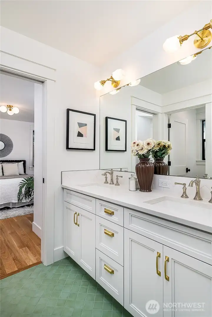 Main level full bath has 2 sinks and both baths have designer tile.