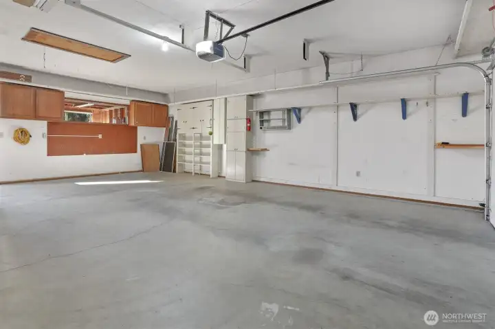 2 car attached oversized 560 sq ft (SCR) garage/workshop.