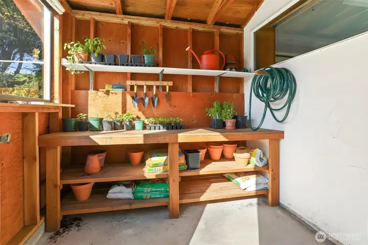 Garden shed on back side of garage - virtually staged photo.