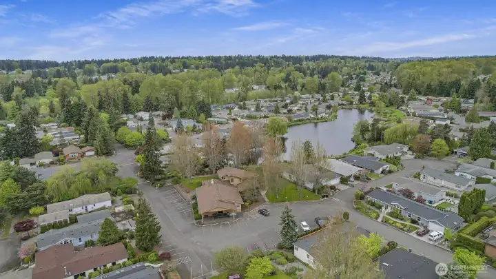 Wandering Creek Common Area: Drone view of the Clubhouse and Reflection lake, just a couple houses away from the home.