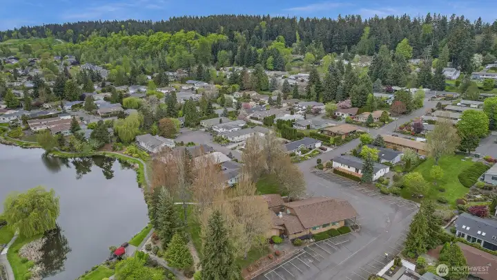 Wandering Creek Common Area: Drone view of the Clubhouse and Reflection lake, just a couple houses away from the home.