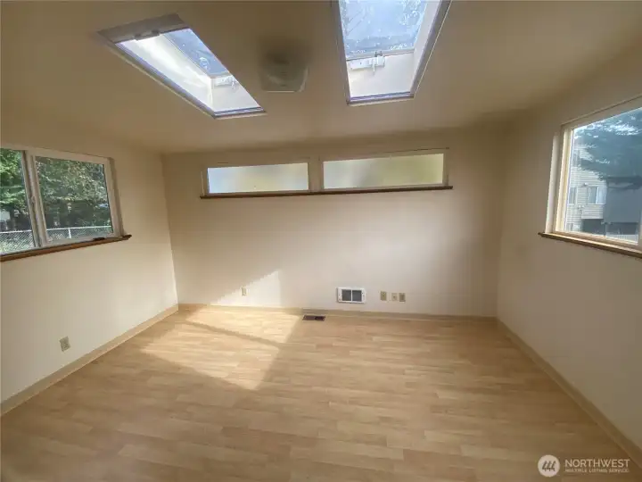 Bonus room off the kitchen with skylights.