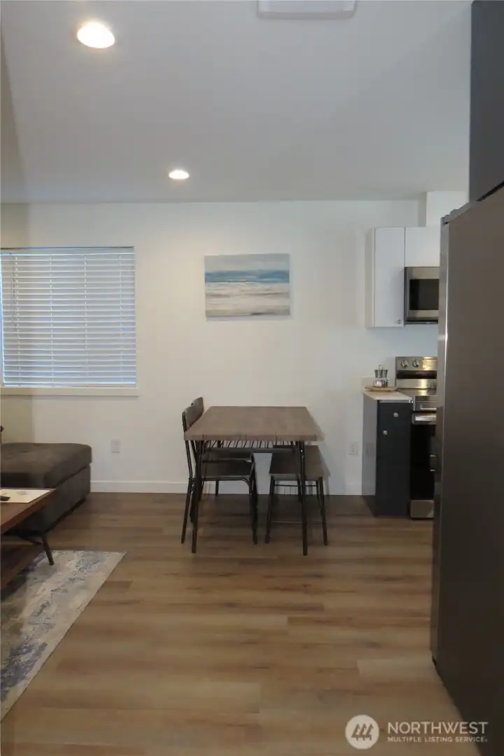 ENTERING THE COTTAGE TO THE FIRST LEVEL WITH EASY CARE VINYL PLANK FLOORING THROUGH OUT!