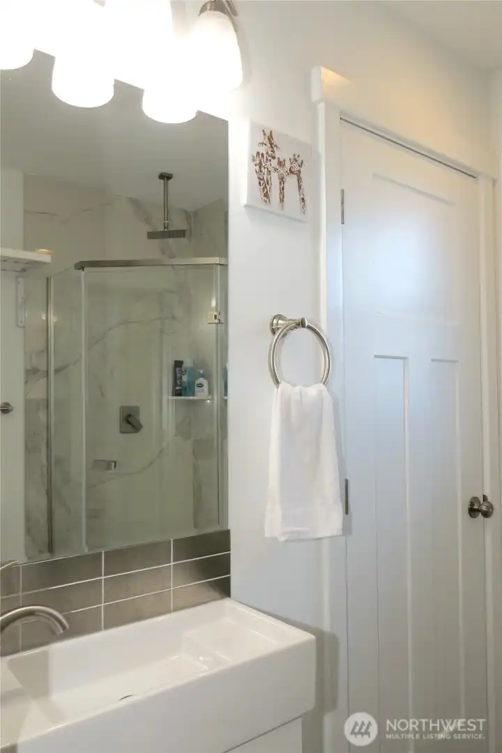 BATHROOM ALSO HAS AN IN-UNIT WASHER AND DRYER BEHIND THE CLOSED DOOR!