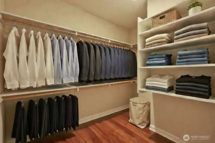 The expansive walk-in closet features abundant hanging space, built-in shelving, and dedicated storage designed for effortless organization. A well-designed extension of the primary suite, it delivers both everyday functionality and a touch of boutique-style convenience.
