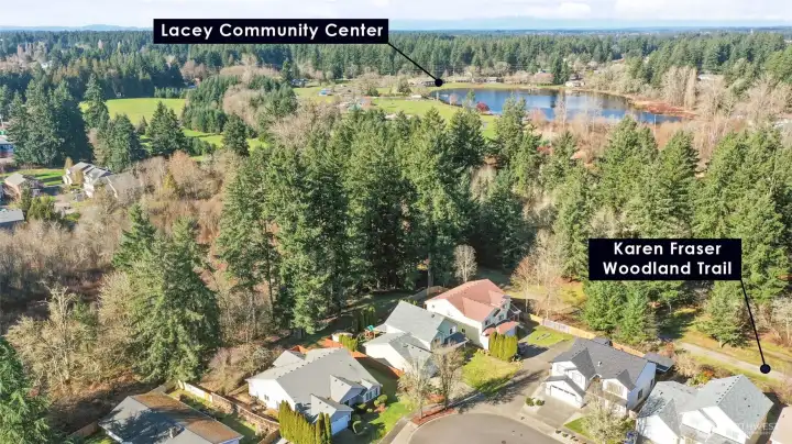 A true highlight of this home is its private backyard gate offering direct access to the lush HOA greenbelt, seamlessly connecting you to Woodland Creek Community Park and the scenic trail system beyond. Enjoy morning walks, playground outings, and peaceful wooded paths just steps from your yard, with the Lacey Community Center conveniently located within the park for year-round events, recreation, and community gatherings. This rare connection to nature and neighborhood amenities creates an exceptional lifestyle of convenience, privacy, and outdoor enjoyment right at your doorstep.
