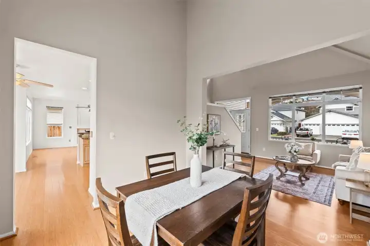 Architectural Interest. From the dining room, appreciate the unique architectural cut-outs and the sense of scale that the high ceilings provide. This view showcases the thoughtful design that keeps the home feeling connected yet offers distinct zones for different activities.