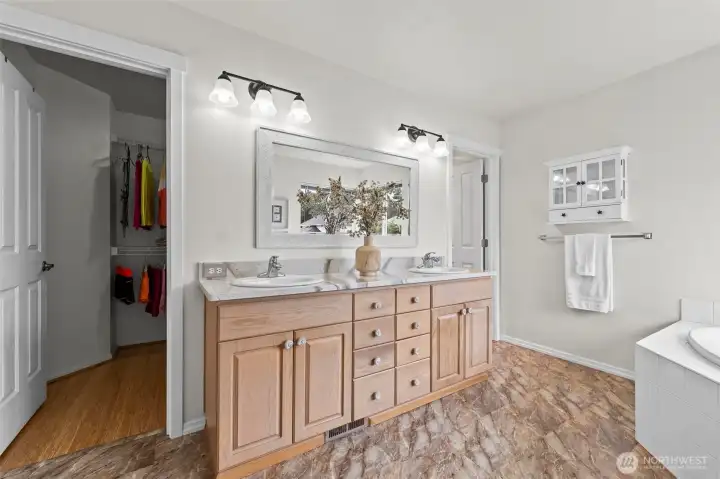 Room for Everything. The primary bathroom offers a generous double vanity with ample storage and stylish lighting. Just steps away, you’ll find the spacious walk-in closet, providing a seamless flow for your morning and evening routines.