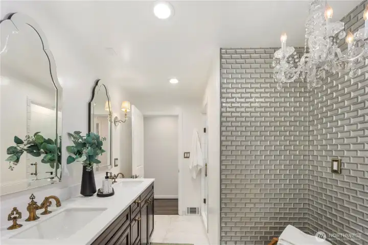 Luxurious guest bath on the main level offers a serene retreat that may make your guests never want to leave.