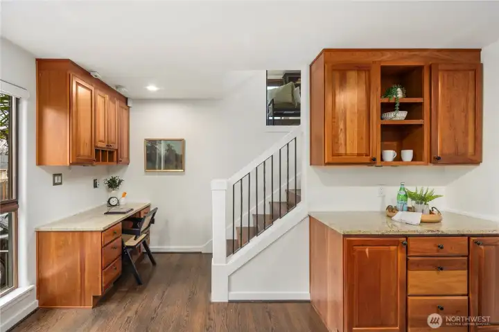 Coffee station with dedicated space for all your favorite mugs makes mornings effortless, while the nearby built-in family command center, with desk, shelving, and organized storage for mail and daily essentials, keeps everyone on track and ready to start the day.