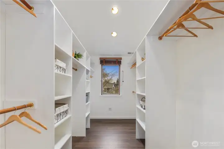 Sumptuous primary suite featuring a spacious walk-in closet and luxurious five-piece bath with soaking tub.