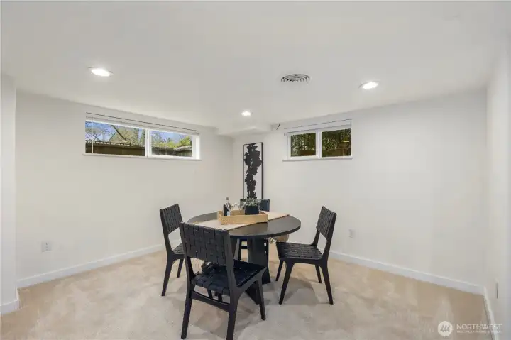 Expansive lower level offers the perfect setting for a media room, play space, or recreation area, complete with a convenient wine fridge.
