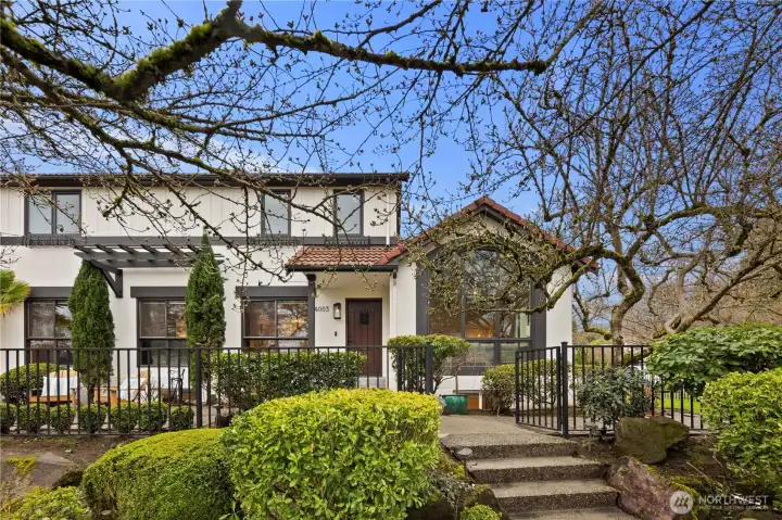 Mature magnolia trees create a stunning seasonal display and add timeless beauty to the home’s outdoor spaces.