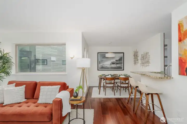 The dedicated dining area is perfectly positioned between kitchen and living room, making dinner parties feel effortless.