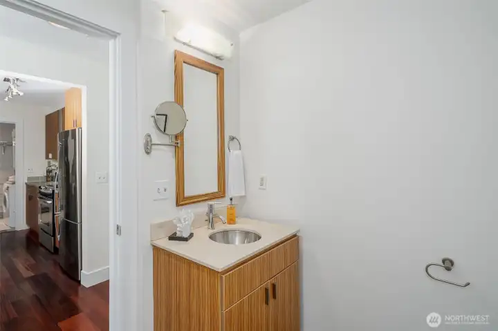 The full bathroom features contemporary tile, quality fixtures, and a smart layout that feels more spacious than you'd expect.