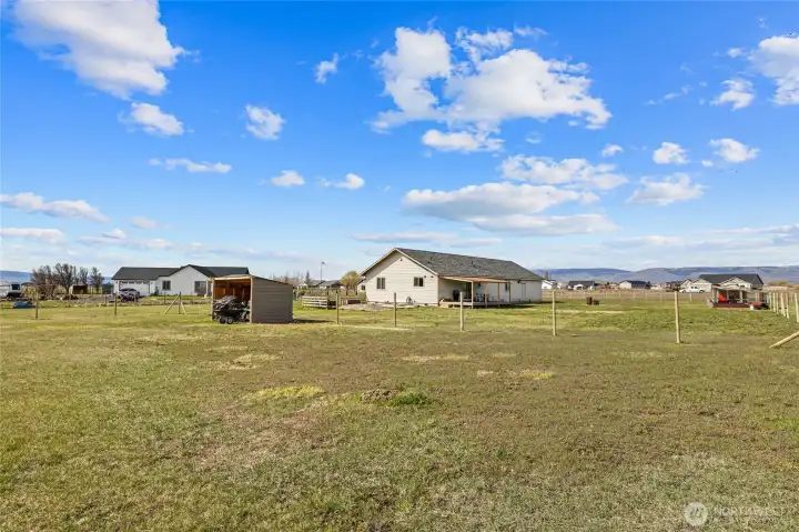 Back of home, almost horse ready!  Fencing has been started.