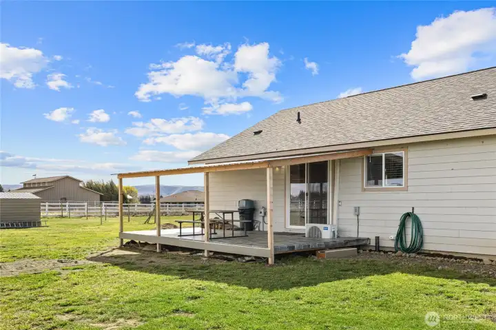 Large covered back deck for year round enjoyment.