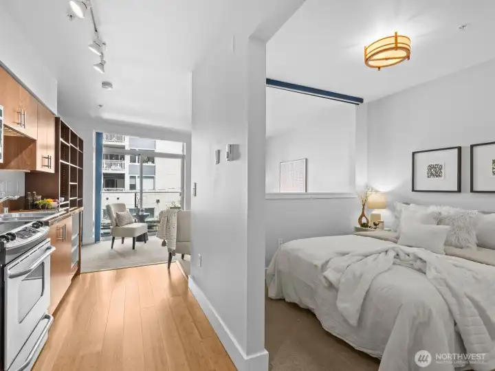 Down the hall is the bedroom on the right.