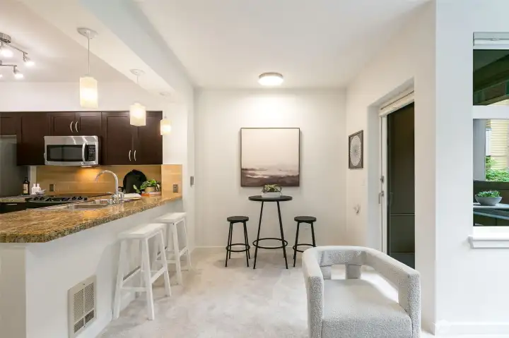 Cook, entertain, and gather with ease in the spacious full-sized kitchen featuring generous counter space .