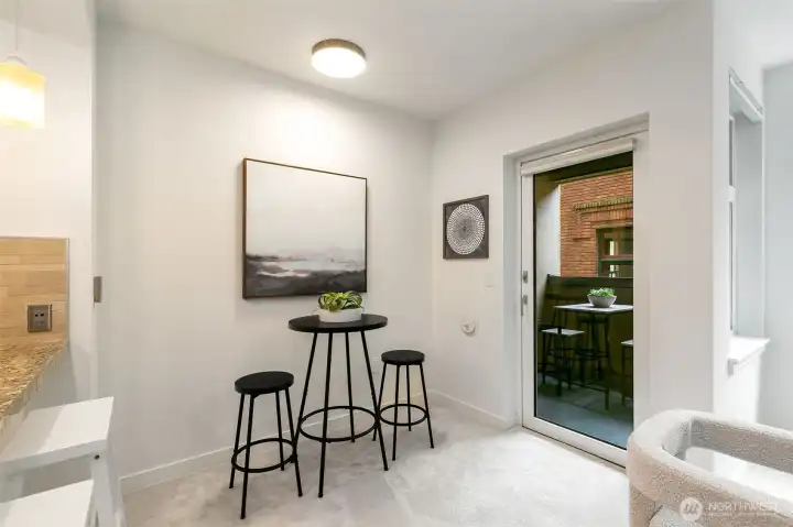 The dining area flows seamlessly to the private balcony—perfect for morning coffee, sunset dinners, or fresh air anytime.